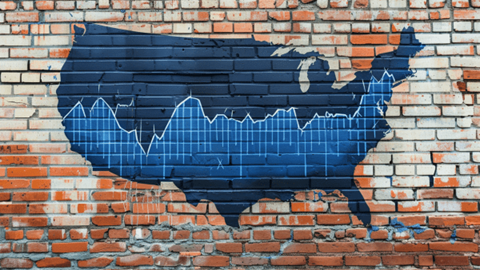 A blue map of the United States with a line graph on it and spraypainted onto a brick wall