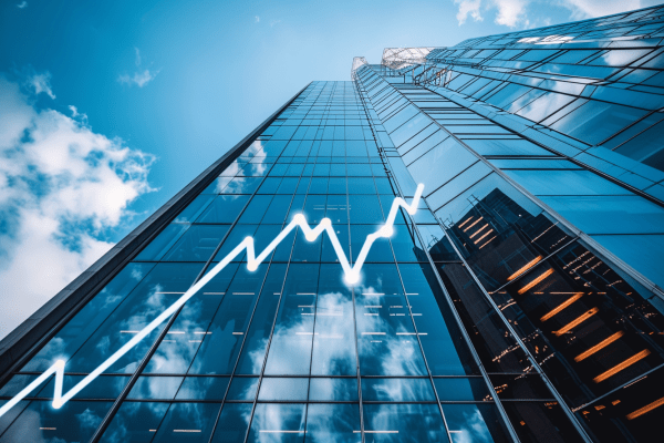 Rising white line graph on the side of a skyscraper