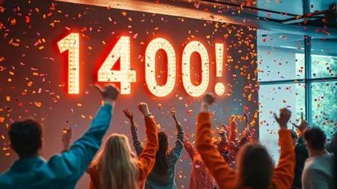 1400! on the wall of an office full of cheering people