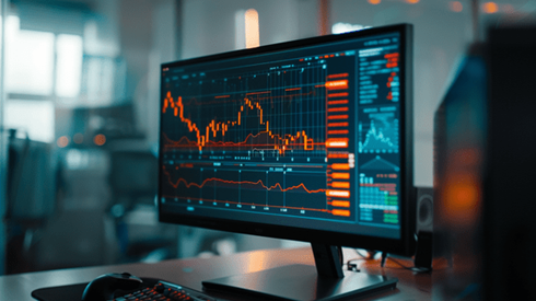 Computer monitor with a flat line graph and a downward trending line graph