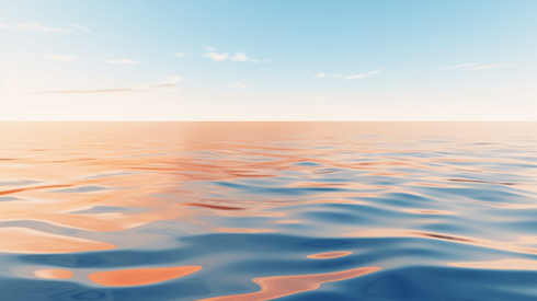 Abstract calm ocean with partially cloudy blue sky above