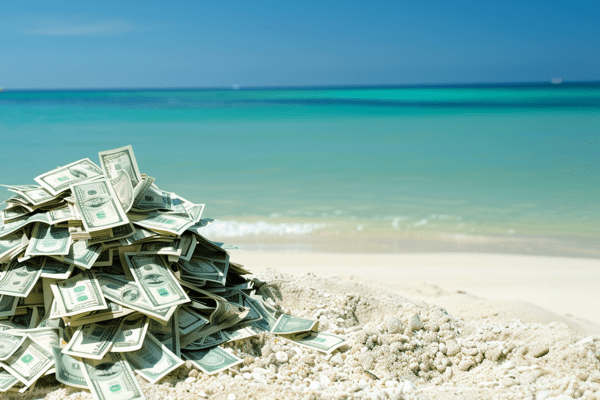 Pile of money on a beach
