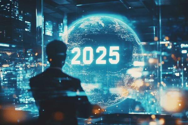 A businessman standing in front of a hologram of a globe with 2025 written on it in an office building