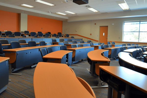 University classroom with rows of desks 