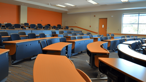 University classroom with rows of desks