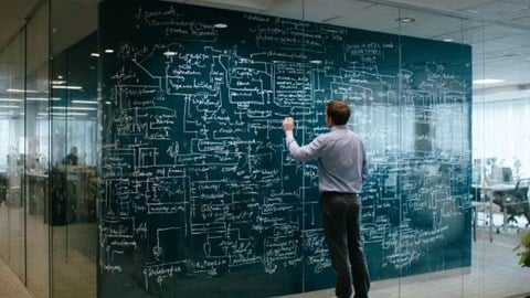 businessman drawing a confusing flowchart on a glass wall in a professional office