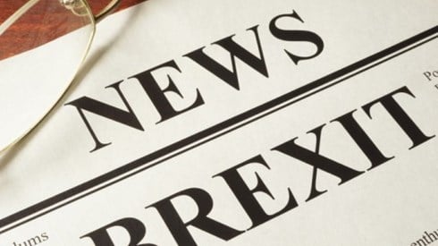 A newspaper with the headline BREXIT and a pair of glasses