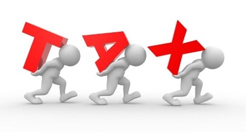 Men carrying the words spelling TAX on their backs