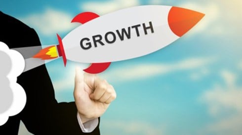 Person holding rocket with growth