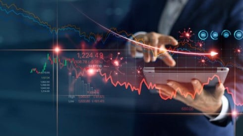 Businessman uses tablet to analyze COVID19 economic fallout data