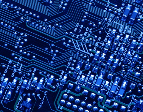 Technological drawing of a circuit board with light blue letters and numbers and connections against dark blue