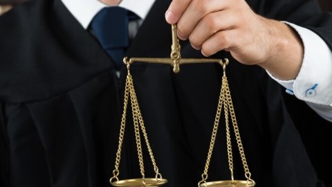 Arbitration Judge With Scales Of Justice