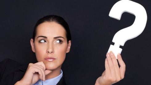 Businesswoman Holding A Question Mark